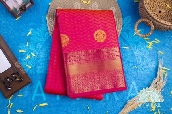 Radiant Pink Silk Saree with Golden Butta, Jari Accents, and Intricate Wave Patterns