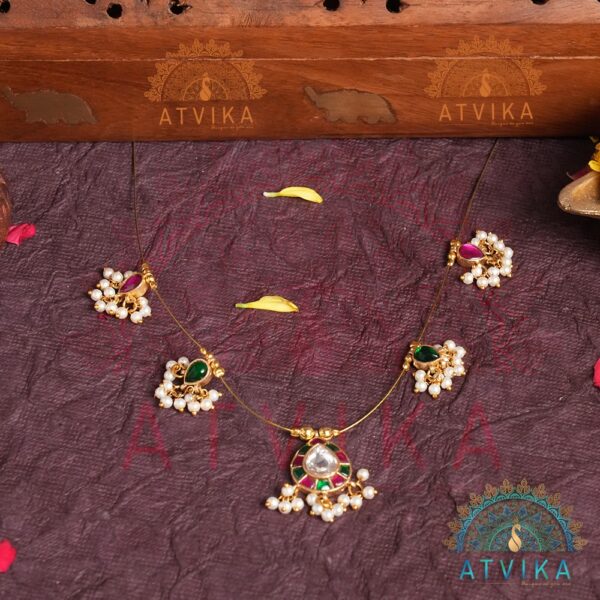a necklace and earrings on a table